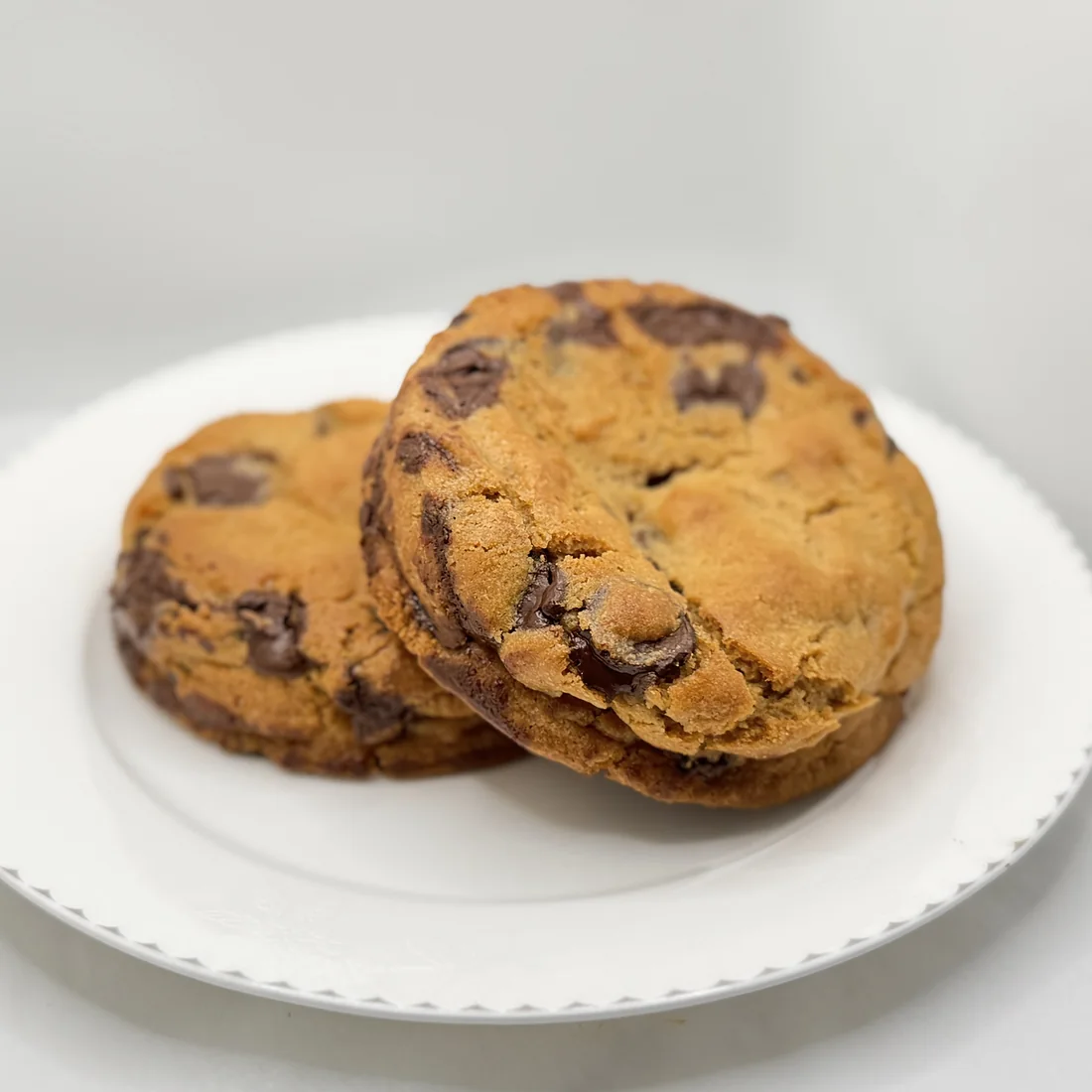 Chocolate chip cookies stacked on a plate